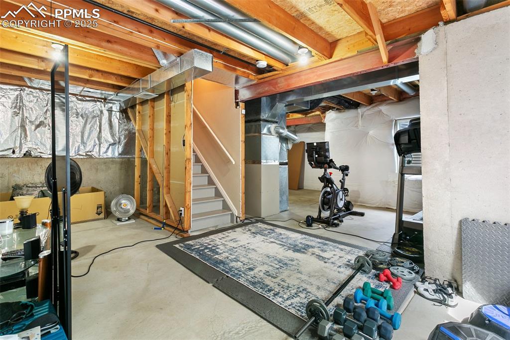 Image 44 of 46: Unfinished below grade area featuring stairs