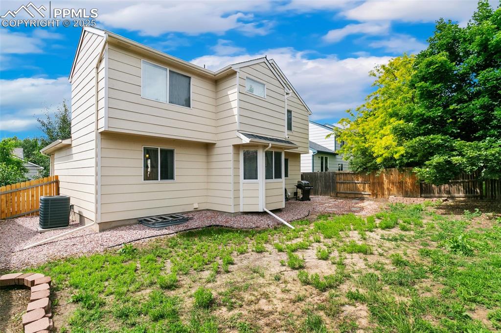 Image 46 of 46: Rear view of property featuring a fenced backyard
