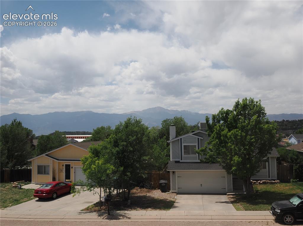 Image 15 of 38: Pikes Peak viewed from the primary bedroom 