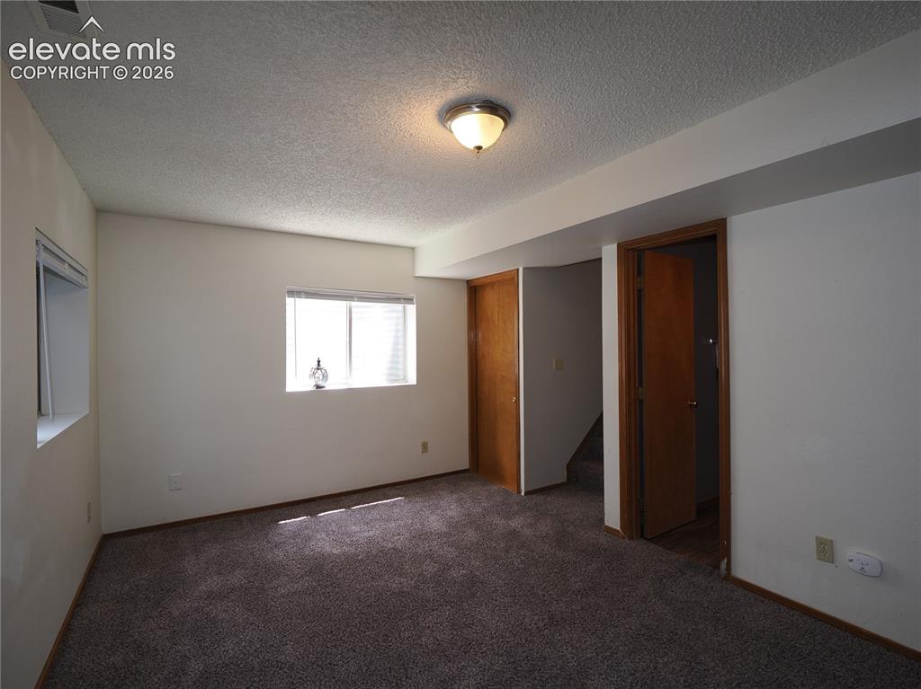 Image 24 of 38: 2nd living area in basement 