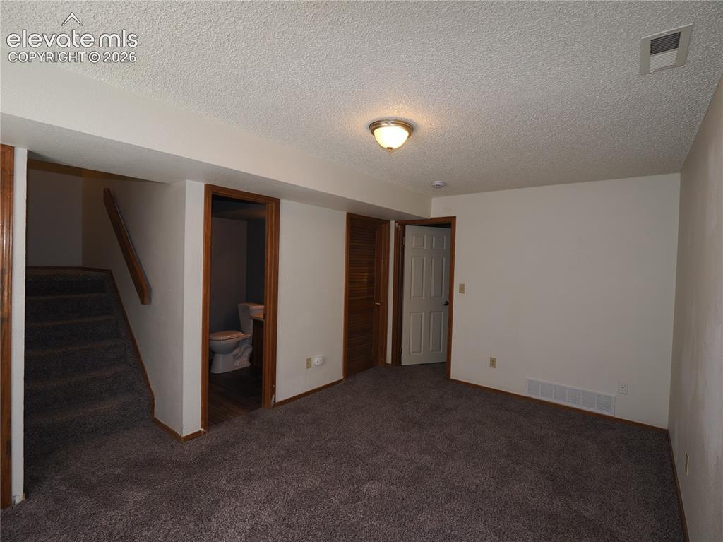 Image 25 of 38: 2nd living area in basement 