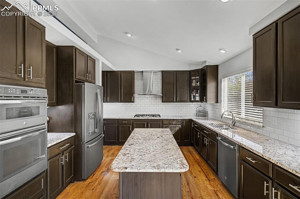 Image 10 of 49: 
A full view of the kitchen reveals its impressive scale — U-shaped with a 