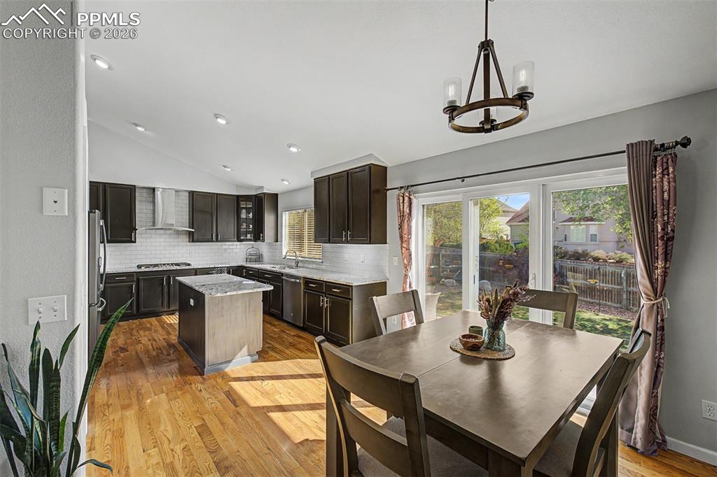 Image 13 of 49: The updated kitchen and dining nook together form the true center of this h