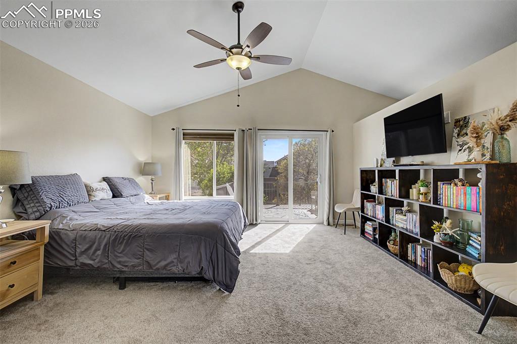 Image 22 of 49: Sunlight streams through the sliding glass door and windows in the primary 