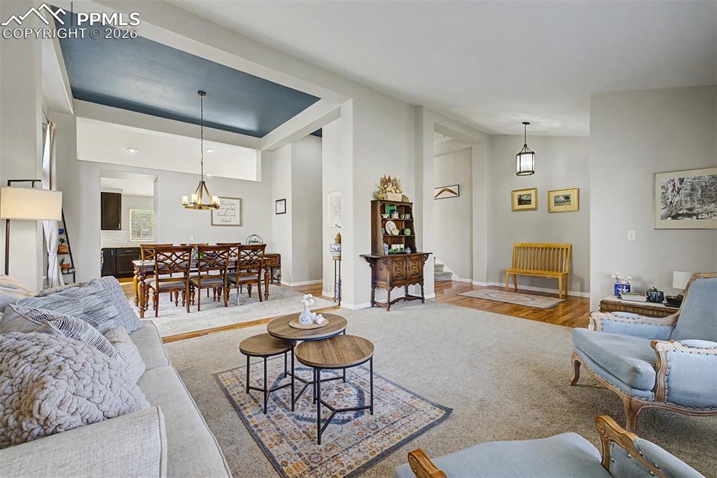 Image 4 of 49: The home opens beautifully into a connected living and formal dining space,