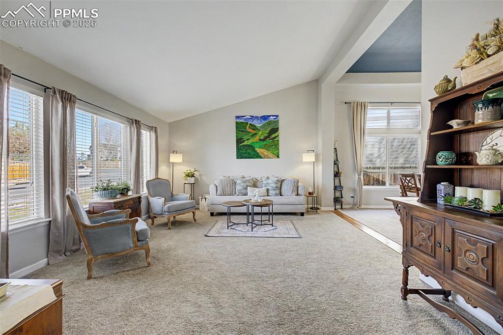 Image 5 of 49: Bathed in afternoon light pouring through oversized windows, the spacious l