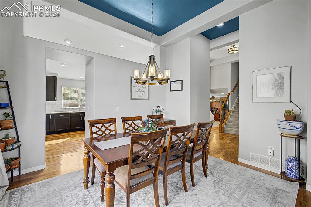 Image 7 of 49: From the dining room, the kitchen comes fully into view, illustrating the h
