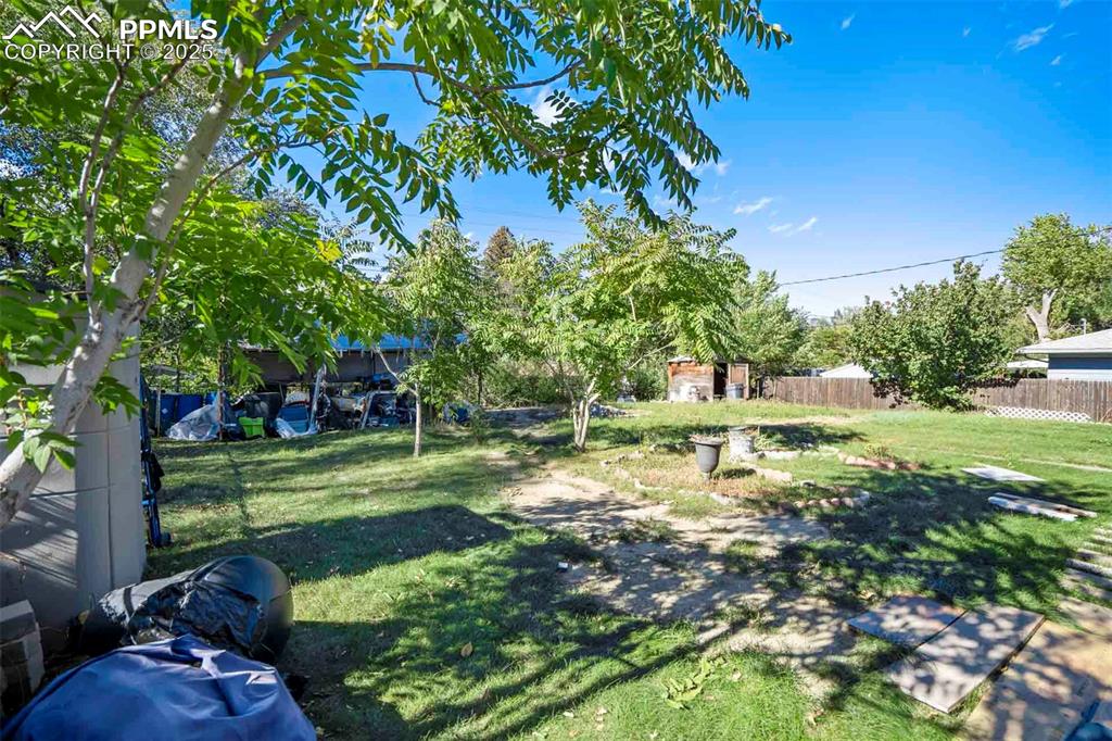 Image 28 of 38: View of yard with a shed