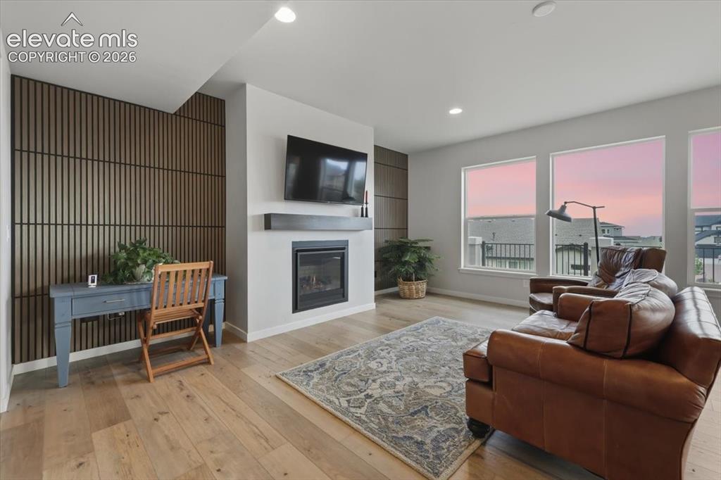 Image 10 of 50: Main floor living area with gas fireplace