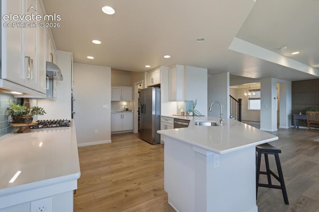 Image 16 of 50: walk in pantry and expansive countertops