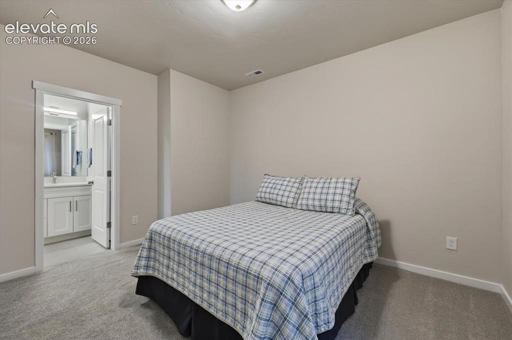 Image 36 of 50: Basement bedroom 5 w/ ensuite