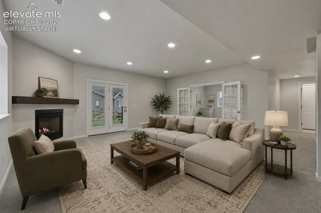 Image 39 of 50: virtually staged- basement family room