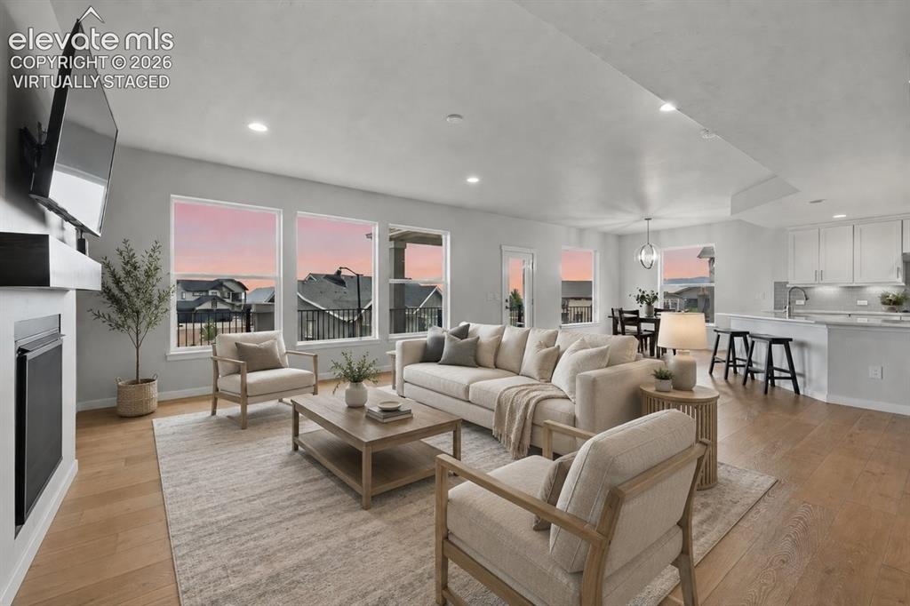 Image 9 of 50: Virtually staged main floor living room 