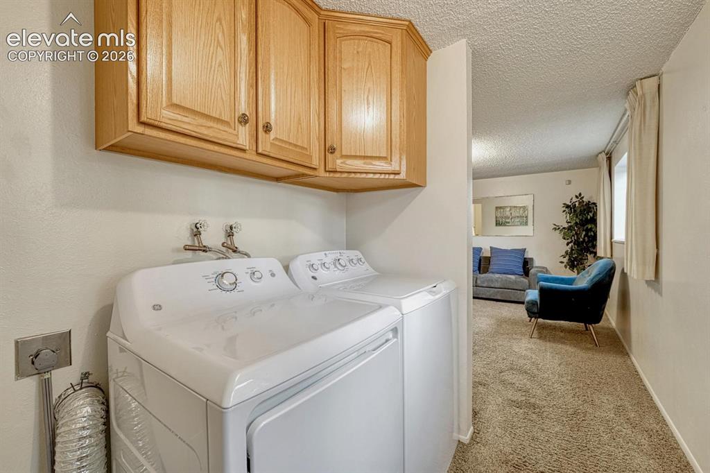 Image 15 of 36: lower level laundry walking into family room