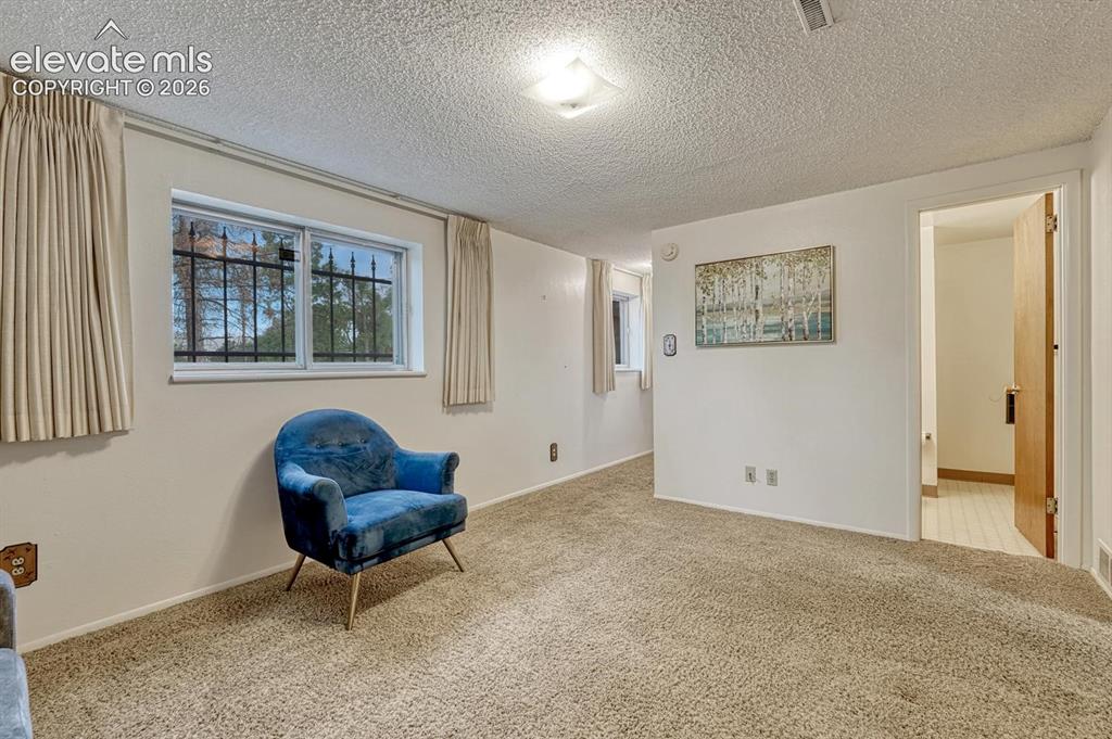Image 17 of 36: family room on lower level with 3/4 bath