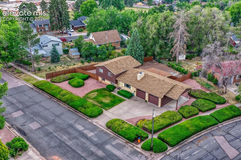 Image 23 of 36: View of entire well kept manicured 1/3 acre corner lot