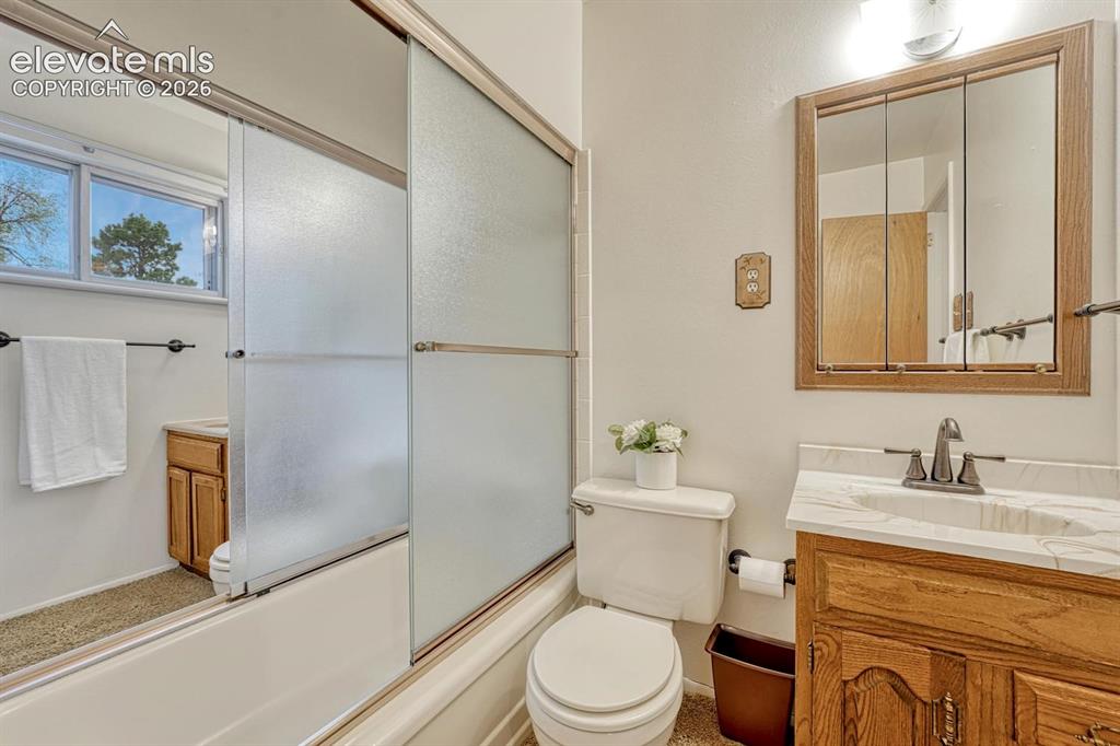 Image 6 of 36: Shared Main bath AND Primary bath on the other side