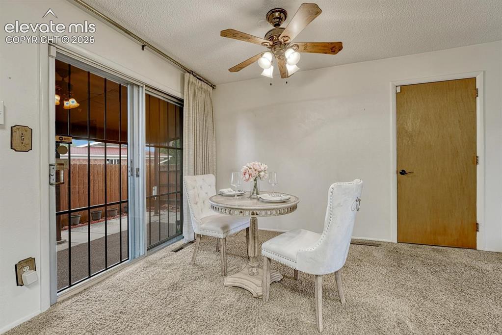 Image 7 of 36: Dining area with walk out to private covered patio.