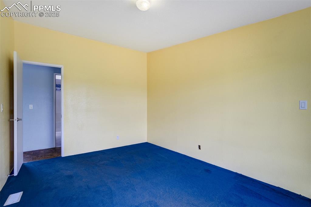 Image 26 of 49: Unfurnished room featuring carpet flooring