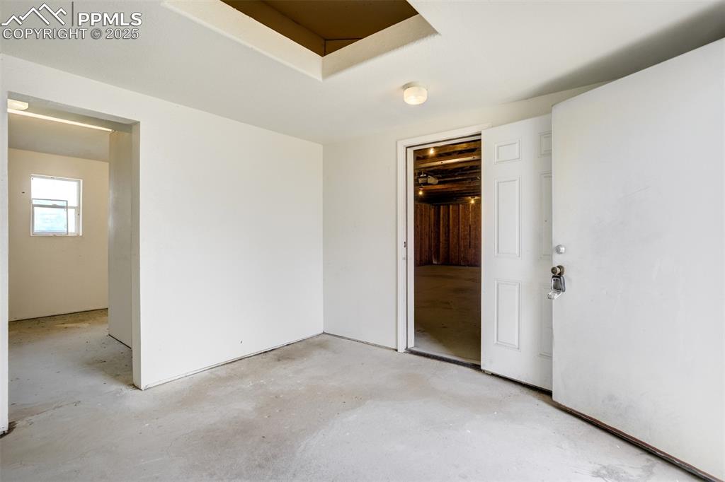 Image 35 of 49: Unfurnished room with concrete floors