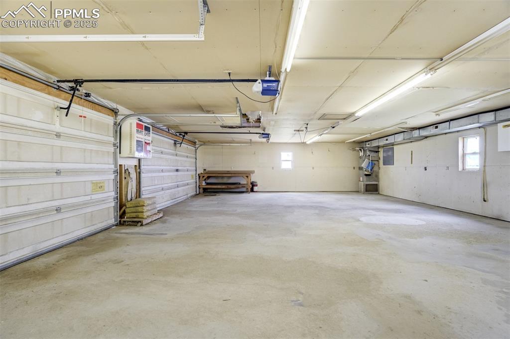 Image 42 of 49: Garage with a garage door opener