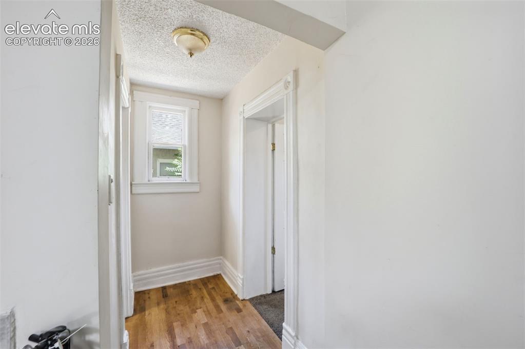 Image 15 of 43: Hallway to Bedroom 1 and Bathroom