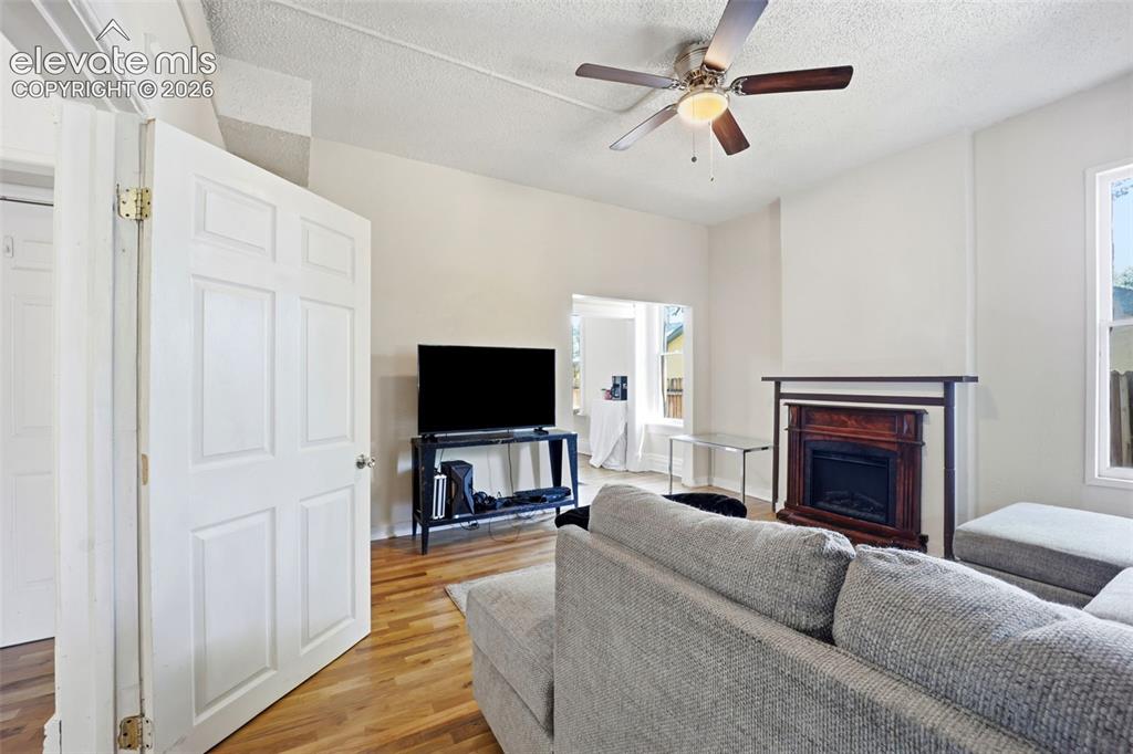 Image 5 of 43: Main Unit 1 with the new hardwood flooring and electric fireplace