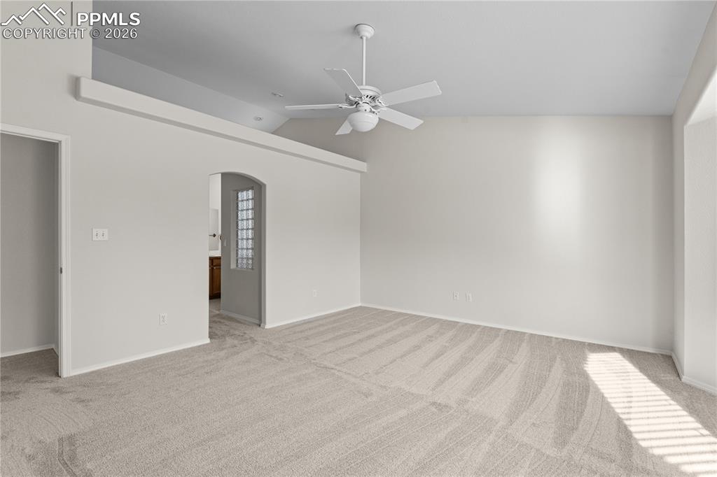 Image 20 of 39: With fresh neutral paint, a quiet view of the backyard, and an attached bat