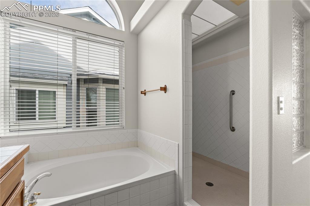 Image 24 of 39: Oversized walk in shower.