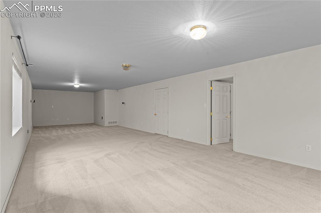 Image 29 of 39: Downstairs has more living space, perfect for a rec room, gym, theatre room