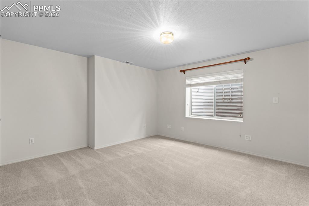 Image 31 of 39: With two lower level bedrooms, this home has it all! Space for guests.