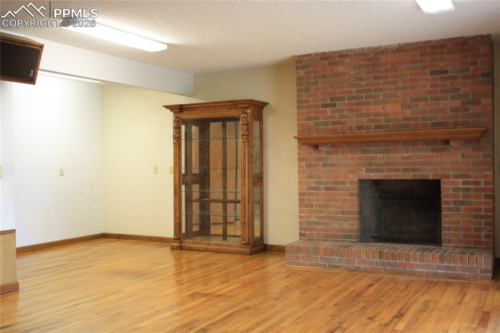 Image 25 of 40: Family Room - Fireplace has gas line built in, needs insert