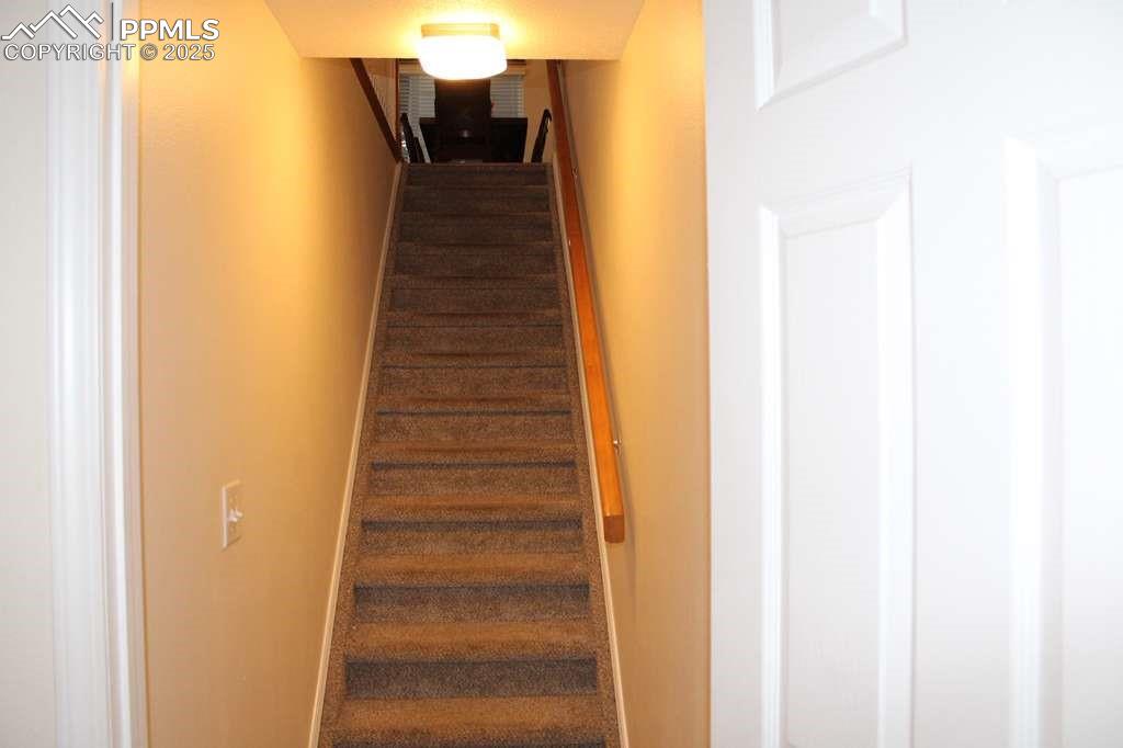 Image 22 of 30: Stairway with baseboards