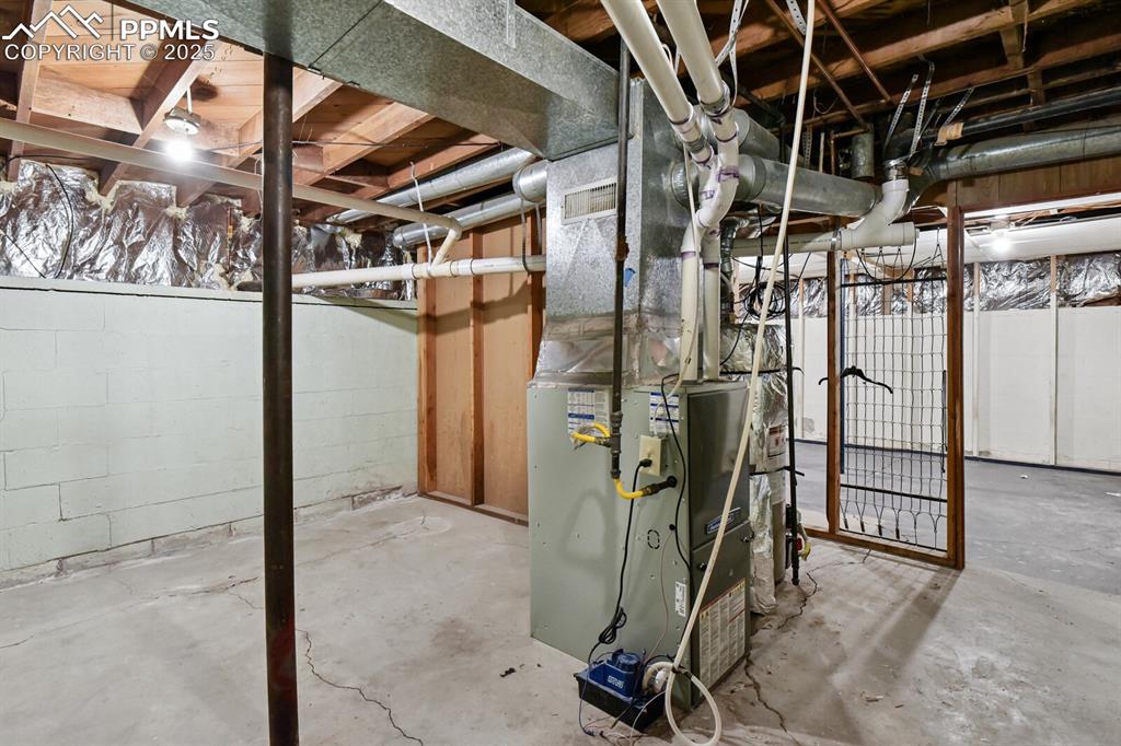 Image 26 of 33: Unfinished basement featuring heating unit