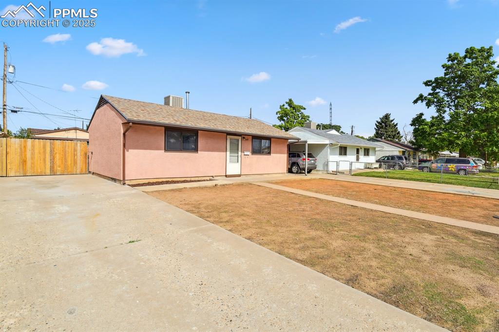 Image 3 of 33: Single story home with concrete driveway, stucco siding, and roof with shin