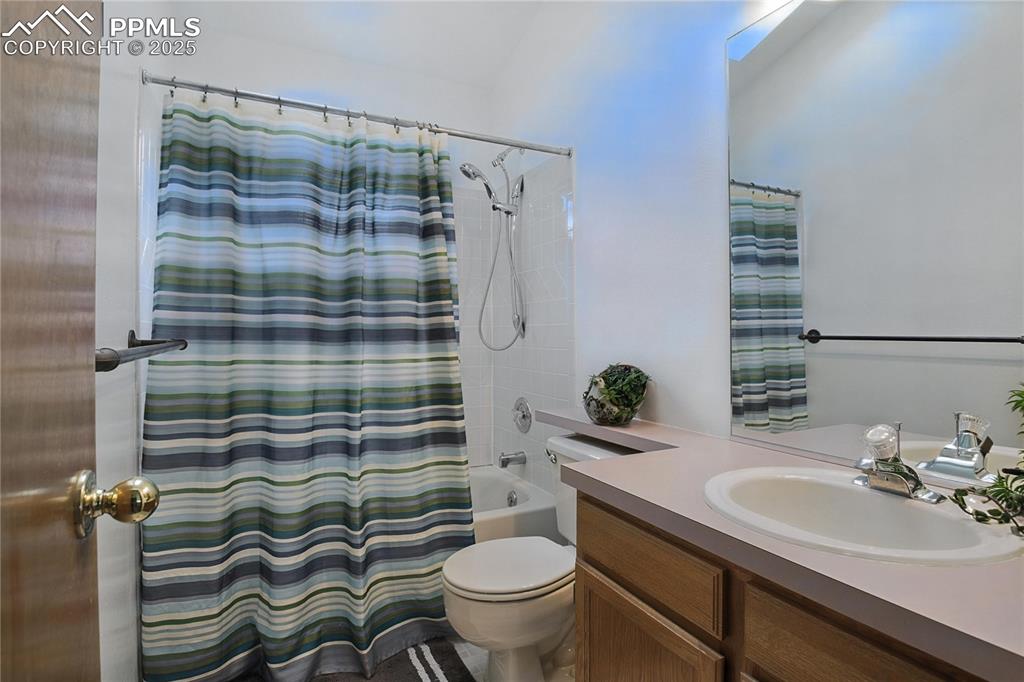 Image 25 of 50: Full bath with vanity and shower / bath combo