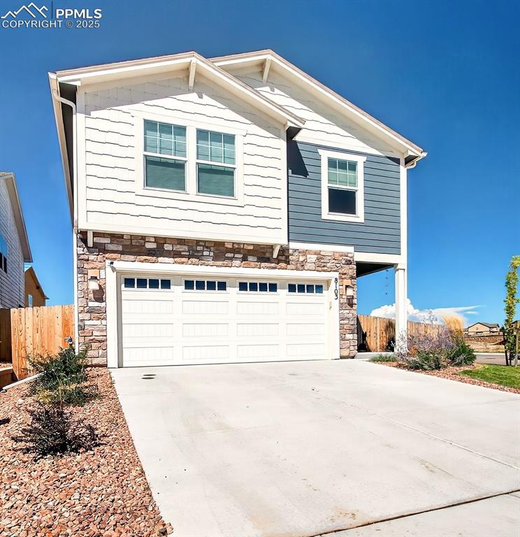 Caption: Front of home with South facing driveway!