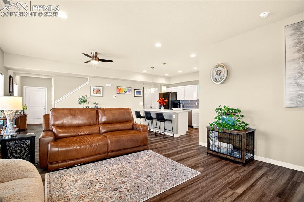 Image 12 of 31: Another view of the family room, dining area and kitchen.