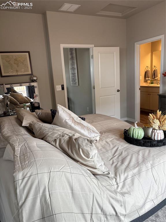 Image 14 of 31: Master bedroom with attached en suite.