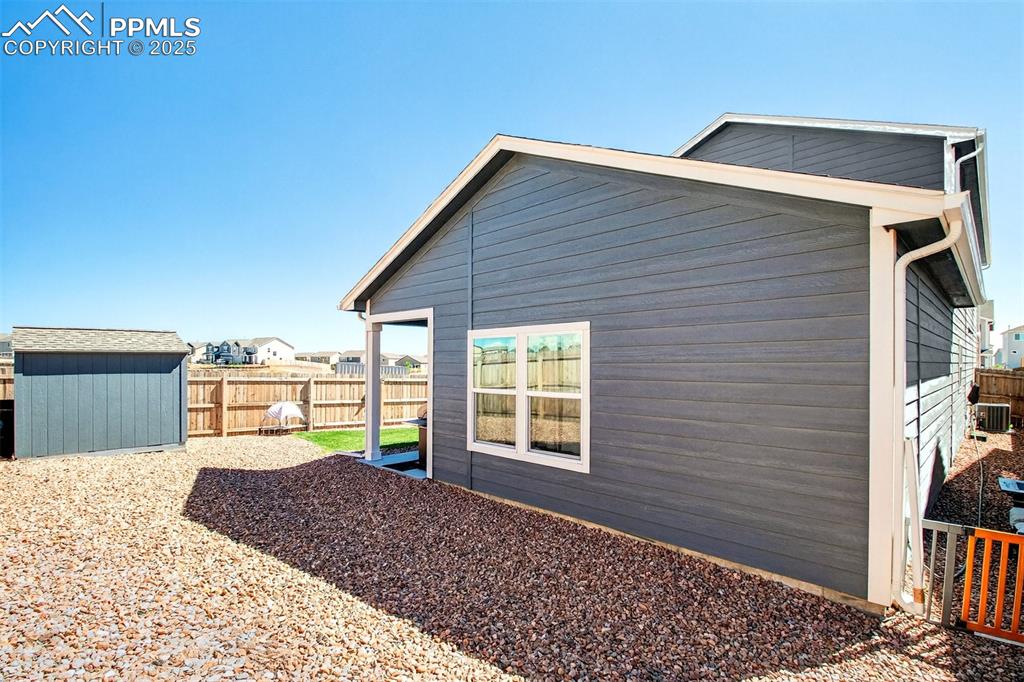 Image 31 of 31: Rear of home to include a new 8x8 Tuff shed.