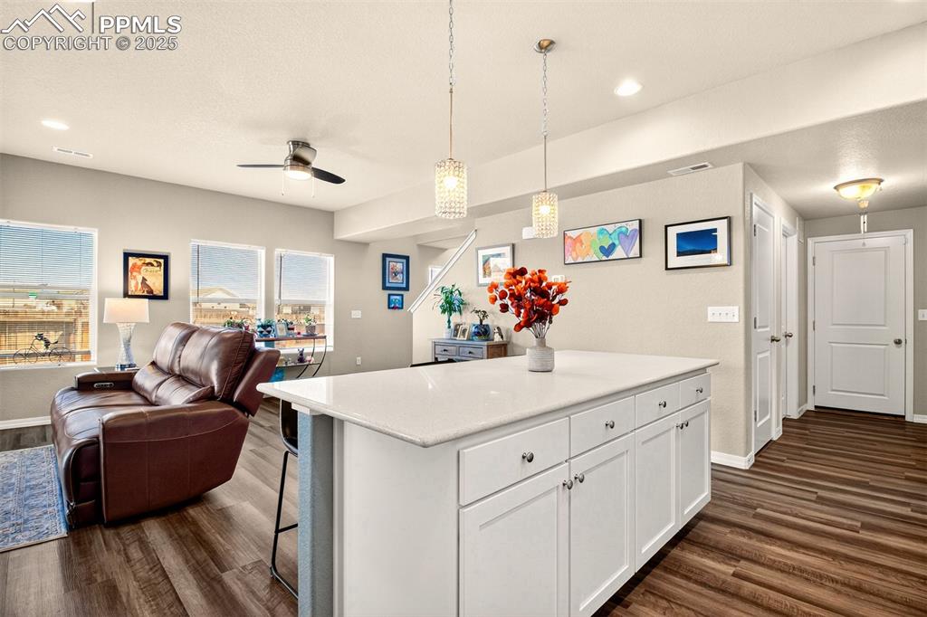 Image 8 of 31: Open and bright floorplan! Hallway leading to the pantry, coffee/breakfast