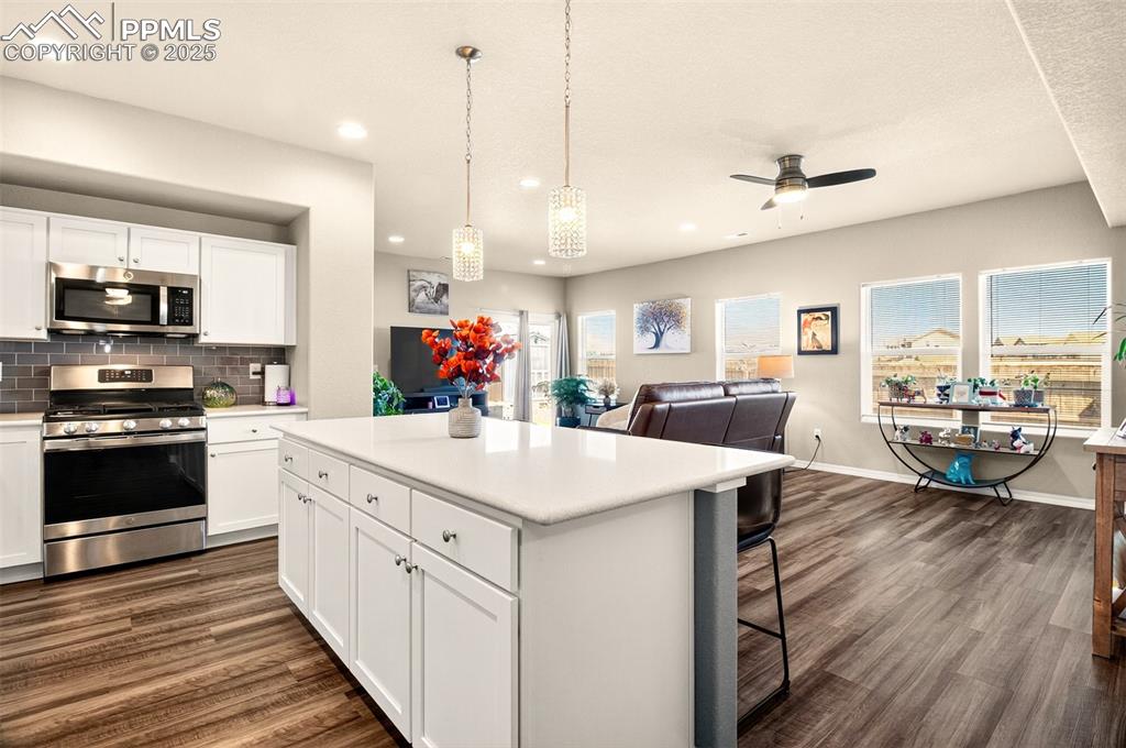 Image 9 of 31: Another view of the kitchen, dining area and family room.