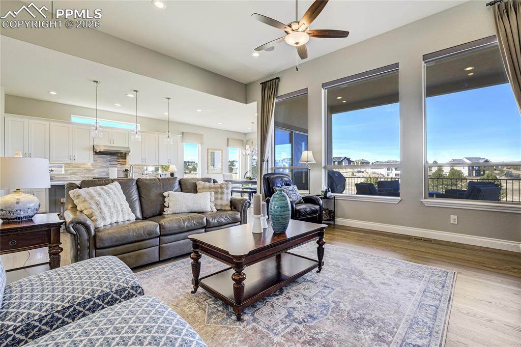 Image 6 of 50: Expansive windows draw in open land and horizon, reinforcing architectural 