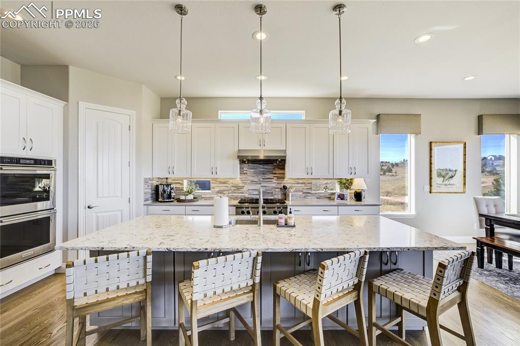 Image 9 of 50: Generous island designed for gathering—blending function, proportion and el