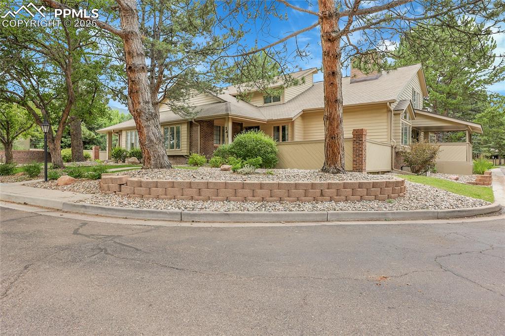 Image 2 of 36: View of front of home with brick siding