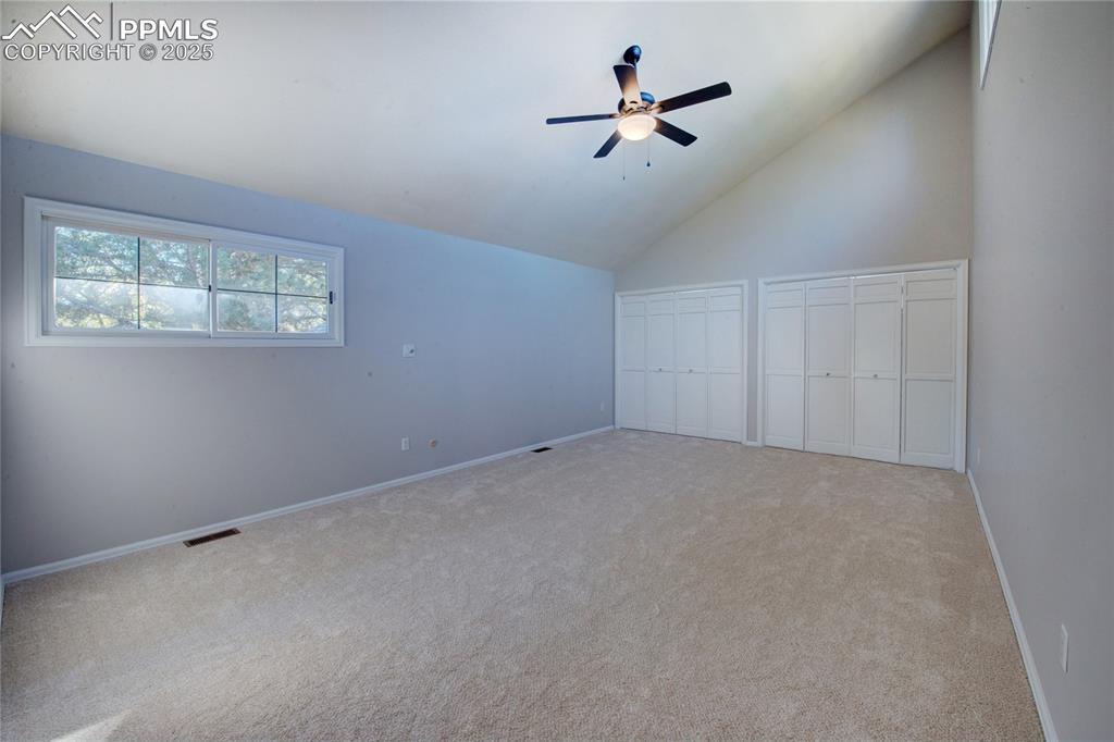 Image 26 of 36: Additional living space featuring a ceiling fan, carpet flooring, and lofte