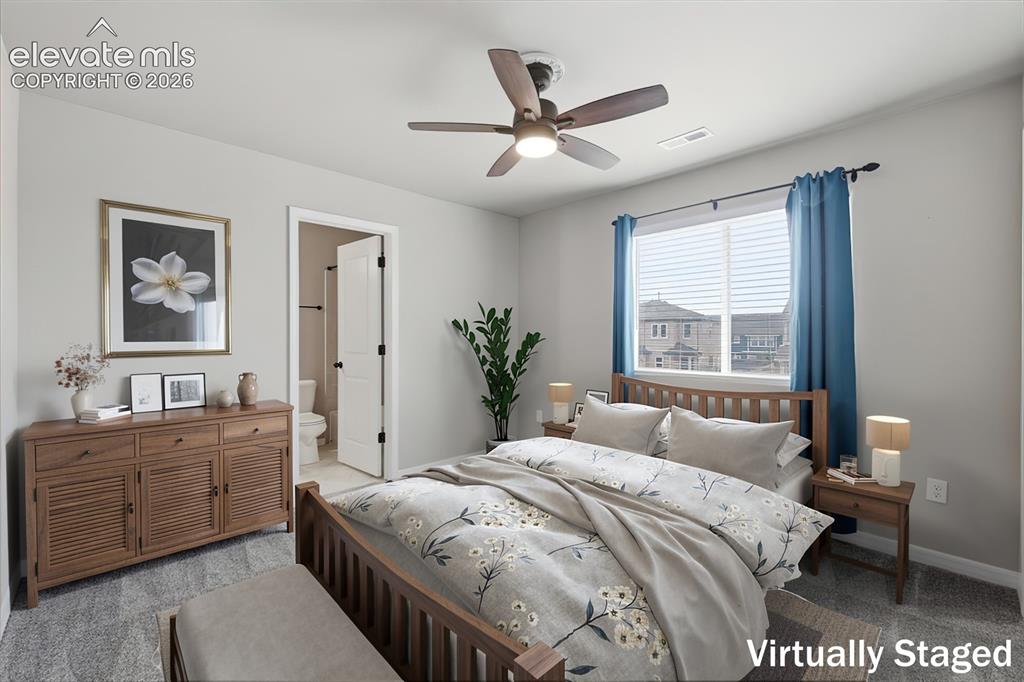 Image 18 of 46: Carpeted bedroom with a ceiling fan, a window with horizontal blinds, and a
