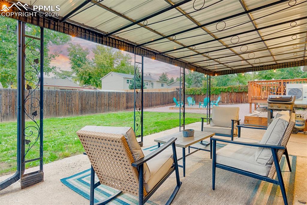 Image 14 of 50: Covered patio accessible from the lower level bedroom / office