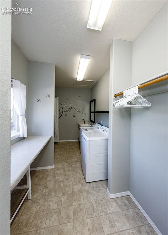 Image 19 of 48: Utility space featuring built-in shelving, a dedicated countertop workspace
