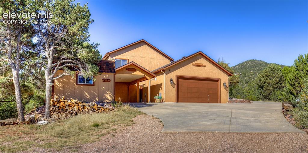 Image 3 of 48: Side of Home, Two Car Garage and Carport